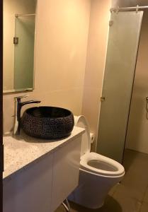 a bathroom with a toilet and a sink at SHP Plaza Khanh Phong Homestay in Hai Phong