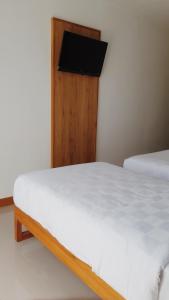 Postel nebo postele na pokoji v ubytování RakaAyu Kuta