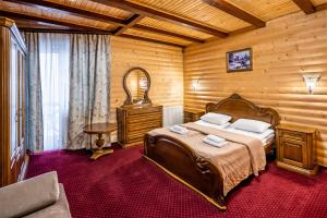 Ein Bett oder Betten in einem Zimmer der Unterkunft Villa Elena SPA & Resort