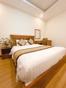 Katil atau katil-katil dalam bilik di Hồng Tùng Hotel