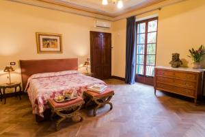 Postel nebo postele na pokoji v ubytování Villa Nichesola