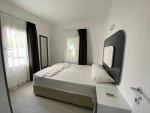 Łóżko lub łóżka w pokoju w obiekcie Manolya Hotel