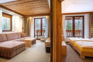 Ein Bett oder Betten in einem Zimmer der Unterkunft Kukučka Lomnica - Tatranská Lomnica