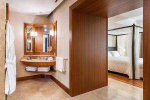 A bed or beds in a room at Il San Corrado di Noto