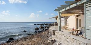 a house with a view of the ocean at Sublime Villa & Caves in Akrotiri