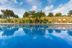 The swimming pool at or close to Il San Corrado di Noto