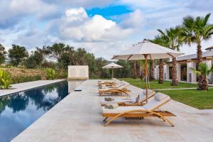 The swimming pool at or close to Il San Corrado di Noto