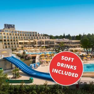 a sign at a resort with a pool and slides at Valamar Parentino Hotel in Poreč