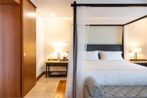 A bed or beds in a room at Il San Corrado di Noto