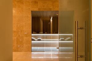 A bed or beds in a room at Il San Corrado di Noto