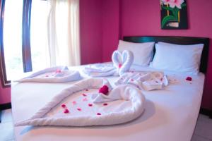 Postel nebo postele na pokoji v ubytování Hotel FX72 Ruteng