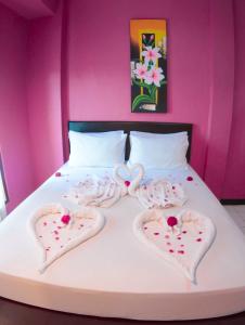Llit o llits en una habitació de Hotel FX72 Ruteng