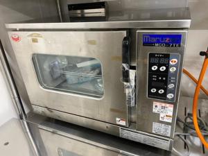 a microwave oven sitting on top of a counter at Yakasoba House in Ginoza