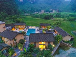 an aerial view of a house with a pool at Yangshuo Yulong River Vision Villa in Yangshuo