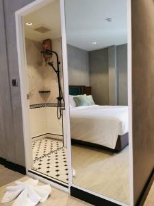 Postel nebo postele na pokoji v ubytování Narawad Boutique Hotel