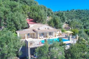 an aerial view of a house with a swimming pool at Villa Kefalaki in Katávolos