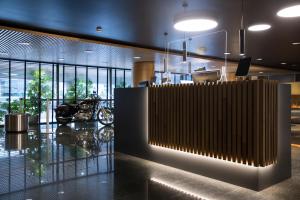 a lobby with a motorcycle parked in a building at Fènix Hotel in Andorra la Vella