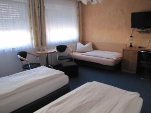 Ein Bett oder Betten in einem Zimmer der Unterkunft Hotel Am Weyerhof