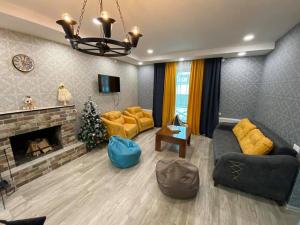 Posezení v ubytování Villa Baghdo Bakuriani