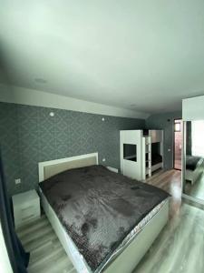 Postel nebo postele na pokoji v ubytování Villa Baghdo Bakuriani