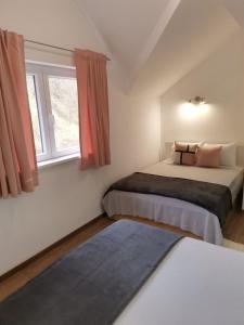 Giường trong phòng chung tại Vila Vrh