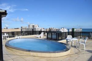 a swimming pool on the roof of a building at Sol de Maceió in Maceió