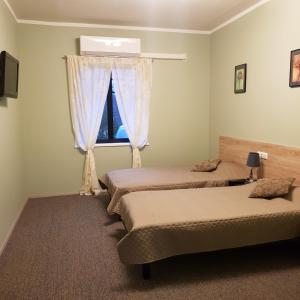 Ένα ή περισσότερα κρεβάτια σε δωμάτιο στο Goodwin Guest House