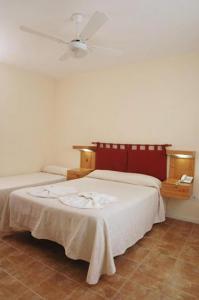 Una cama o camas en una habitación de Hotel Patio del Mar