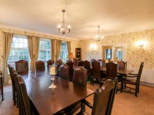 a conference room with a large wooden table and chairs at Yardley Manor in Scarborough