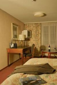 Postel nebo postele na pokoji v ubytování Hotel Krone