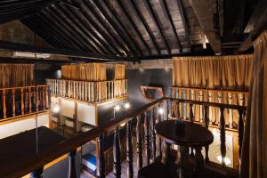 a view of a room with bookshelves and a table at The Clock Hostel & Suites in Cartagena de Indias