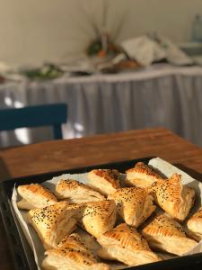 a tray of bagels in a pan on a table at Halikarnas Pansiyon in Bodrum City