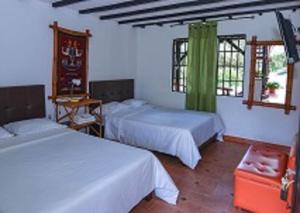 Hotel Alto de los Andaquies客房内的一张或多张床位