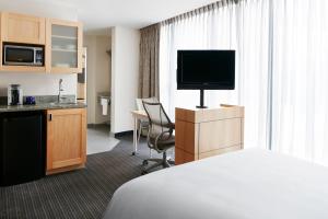 TV a/nebo společenská místnost v ubytování World Center Hotel