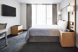 Postel nebo postele na pokoji v ubytování World Center Hotel