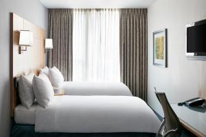 Postel nebo postele na pokoji v ubytování World Center Hotel