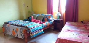 Kama o mga kama sa kuwarto sa 3 bedrooms house with furnished garden and wifi at Bonne Terre