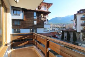 a balcony with a view of a building at 2 bedroom apartment near Gondola in Bansko