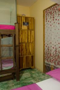 Postel nebo postele na pokoji v ubytování Hostal Corazón de Tagua