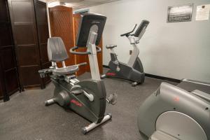 a gym with two exercise bikes and a treadmill at The Rundlestone Lodge in Banff