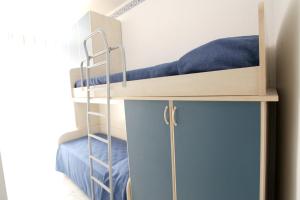 A bed or beds in a room at Charming House in Ragusa + City View