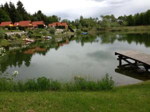 a lake with a picnic table in the middle of it at Ferienhaus Beme in Spielberg
