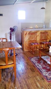 a dining room with a table and chairs and a counter at Studio with sea view terrace and wifi at Souillac 1 km away from the beach in Souillac