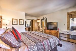 a bedroom with a bed and a flat screen tv at Ski-InandSki-Out Beaver Creek Condo with Mtn Views! in Beaver Creek