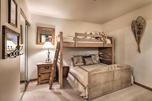 a bedroom with two bunk beds and a lamp at Ski-InandSki-Out Beaver Creek Condo with Mtn Views! in Beaver Creek +18 photos