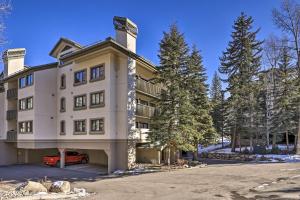 a building with a car parked in front of it at Ski-InandSki-Out Beaver Creek Condo with Mtn Views! in Beaver Creek