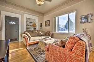 a living room with a couch and a table at The Diamond Bungalow - Cozy Caldwell Home! in Caldwell
