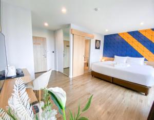Ένα ή περισσότερα κρεβάτια σε δωμάτιο στο Hotel Fuse Rayong