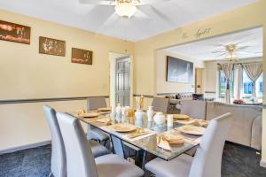 a dining room with a long table and chairs at Sweet Home Georgia - Entire 3 bedroom Luxury in Duluth