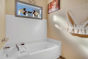 a bathroom with a white sink and a window at Sweet Home Georgia - Entire 3 bedroom Luxury in Duluth +74 photos
